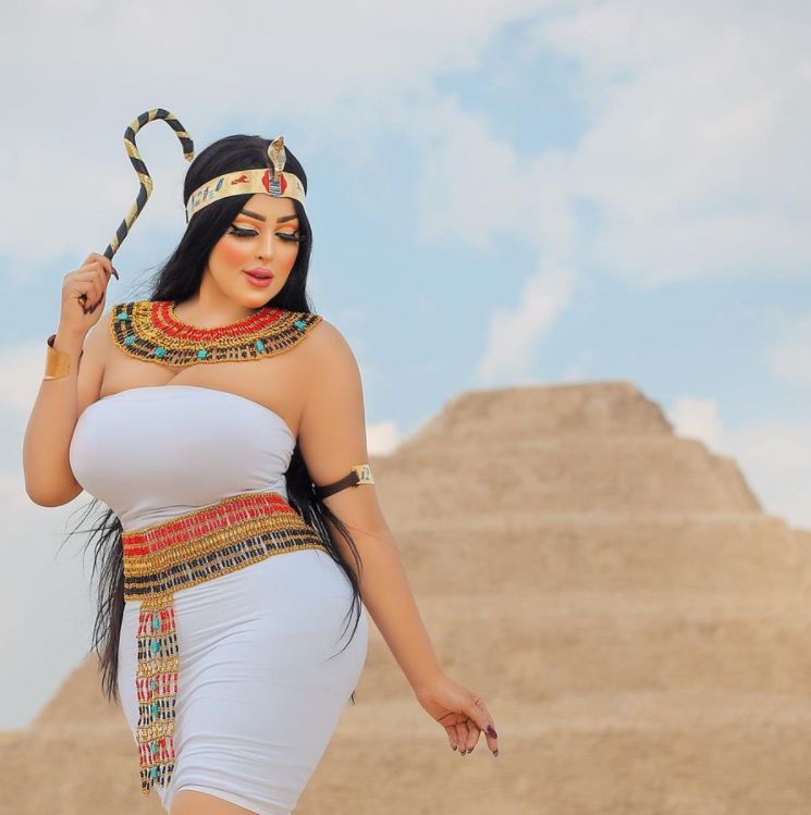 Egyptian model arrested for photoshoot in front of pyramid.