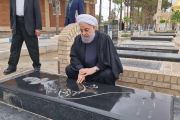 The former president visits graves of his parents